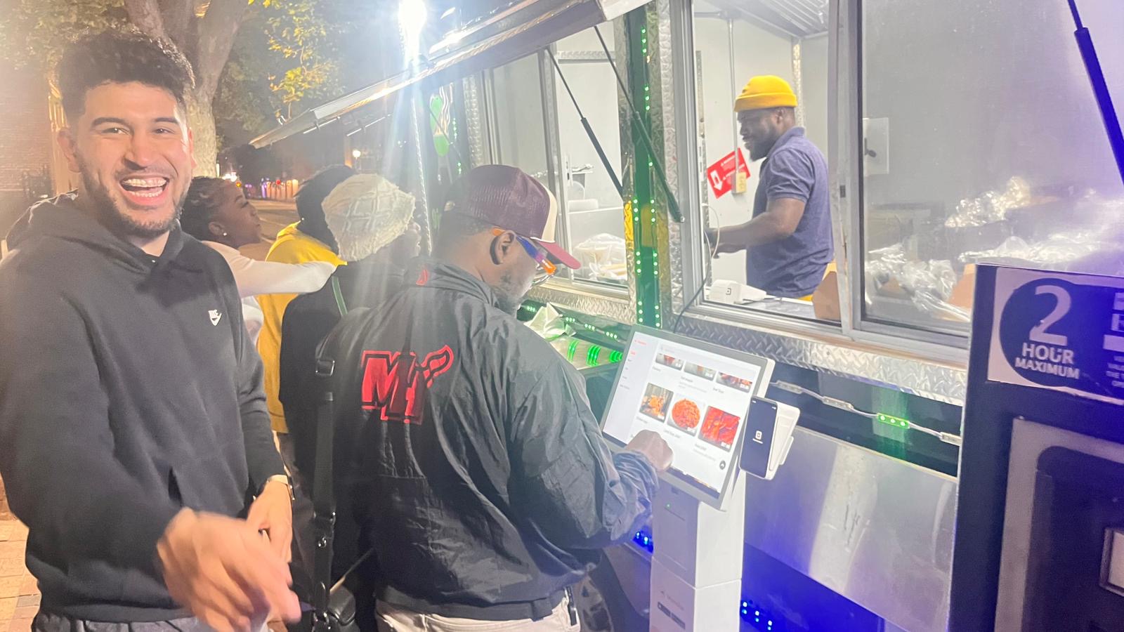 Chef serving from the 9jaGrills food truck window